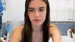 Small titted brunette teen fingering on the bed