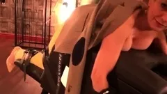 Lady Sonia caged and strips nude in the sex dungeon