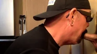 Inked mature DILF blowing gloryhole BBC