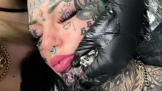 Australian bombshell Amber Luke gets a new chin tattoo
