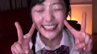 Japanese cutie takes bukkake facial