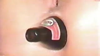 Horny slut fucks her ass with beer bottle