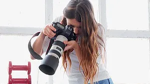 Baby Nicols strips while Talia Mint photographs her and they have sex