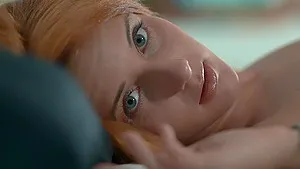 Petite redhead girl Roberta Berti strips in the bed and teases