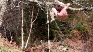 Naked self-bondage in the woods gone wrong.