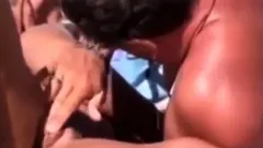 a couple masturbates on nudist beach