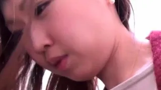 Asian woman in pantyhose pisses