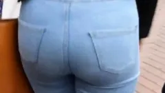 Candid blonde teen with sexy curves in jeans