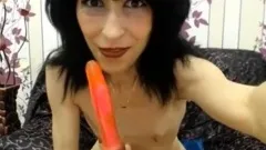 skinny mature babe strips and fucks her dildo