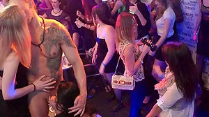 Bunch of girls blow a dick of a male stripper and some even give pussy