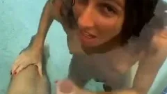 Funny handjob inside swimming pool