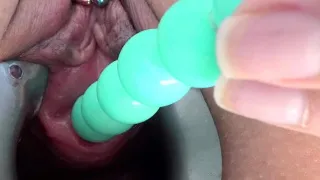 Female masturbate her pee hole with a huge dildo of balls