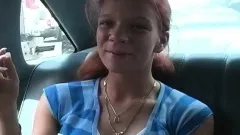 Ravishing redhead with big round boobs gives a nice blowjob in the car