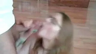 amateur girl with glasses stripteases and swallows