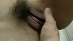Young Asian MILF uses her mouth to pleasure a thick hairy cock