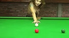 Inked beauty Kate bends over the billiard table to show off some curves
