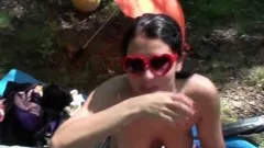 Nudist babes enjoy themselves with a sexy picnic out in the woods