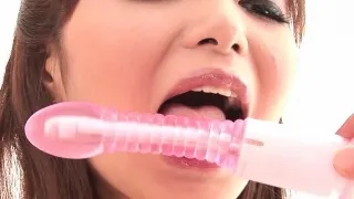 Cute Asian teen Sakurako plays with a vibrator and teases