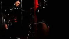 Fine slave girl gets tied down to a table and bound in latex