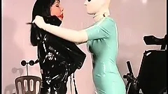 Latex fetish slave does what the naughty nurse wants her to do