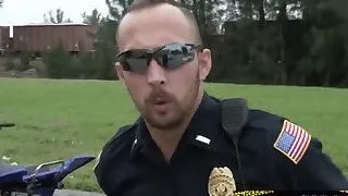 Knowing what's coming this criminal tries to break car window