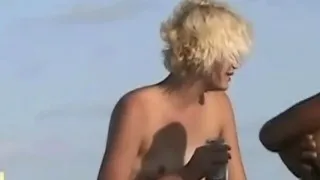 Naked hotties followed around by a nude beach voyeur