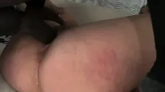 Charming blonde moves on top of the black stud and sticks his huge rod in her twat