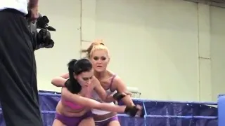 Lesbian babes wrestling in a boxing ring