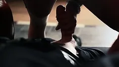 Sexy brunette in latex and high heels fellates her hung lover