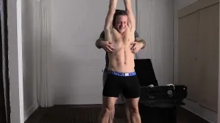 Fit and cute dude Kenny gets his feet tickled by older man.