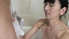 She gets sudsy in the shower then gets on her knees for a blowjob