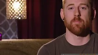 Redhead swinger sucks big cock at orgy