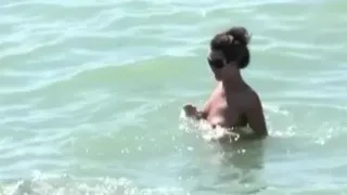 Teeny girls have fun at the nude beach