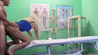 Doctor helping petite blonde patient to giving sample