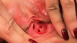 Ideal teen is gaping soft twat in close-up and getting off