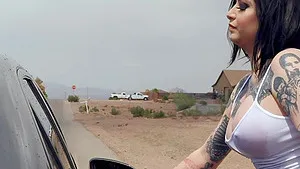 Goth tattooed babe Ophelia Rain gets cum on face in a car