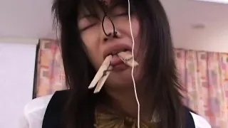 Asian brunette getting roped up and tongue pegged