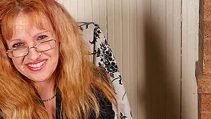 Mature red head amateur Deisy plays with her favorite toy and strips