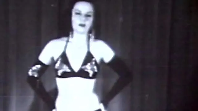 Impressive brunette in retro femdom