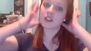 Cute redhead amateur teen strips and cums