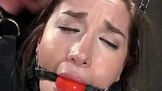 Slave in strait jacket whipped in bondage