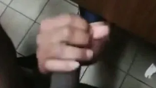 stranger reaches under stall and gives a helping hand