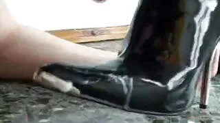 Licking cum from boots of mistress