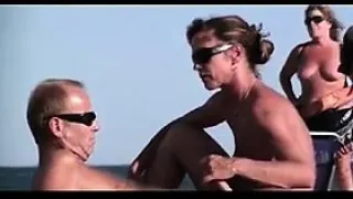 MILF Giving A Blowjob At The Beach