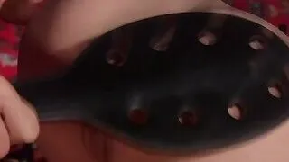 Lesbian slave ass paddled in corset shop