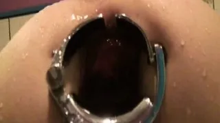 Tight asshole stretched by speculum for a water enema