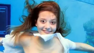 Cute Zuzanna is swimming nude in the pool