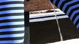 Cutie wets her striped tights in a park