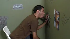 Latino gay dude sucks a big hard black glory hole cock