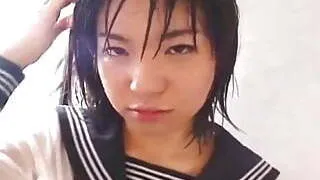 Young Japanese schoolgirl gives her first blowjob